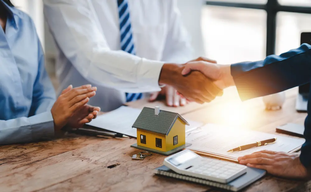 People signing mortgage documents