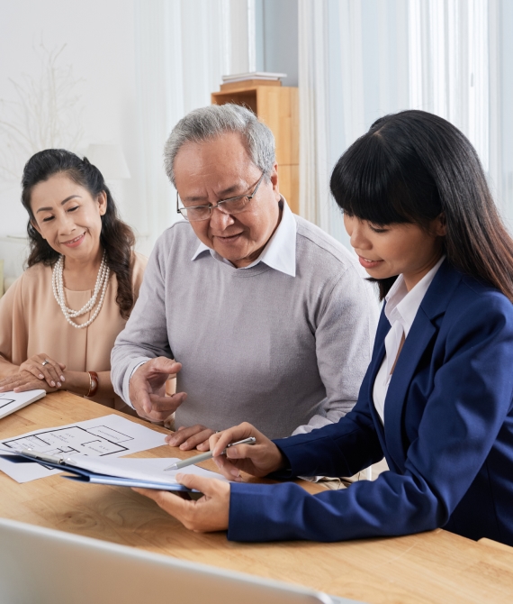 People signing mortgage documents